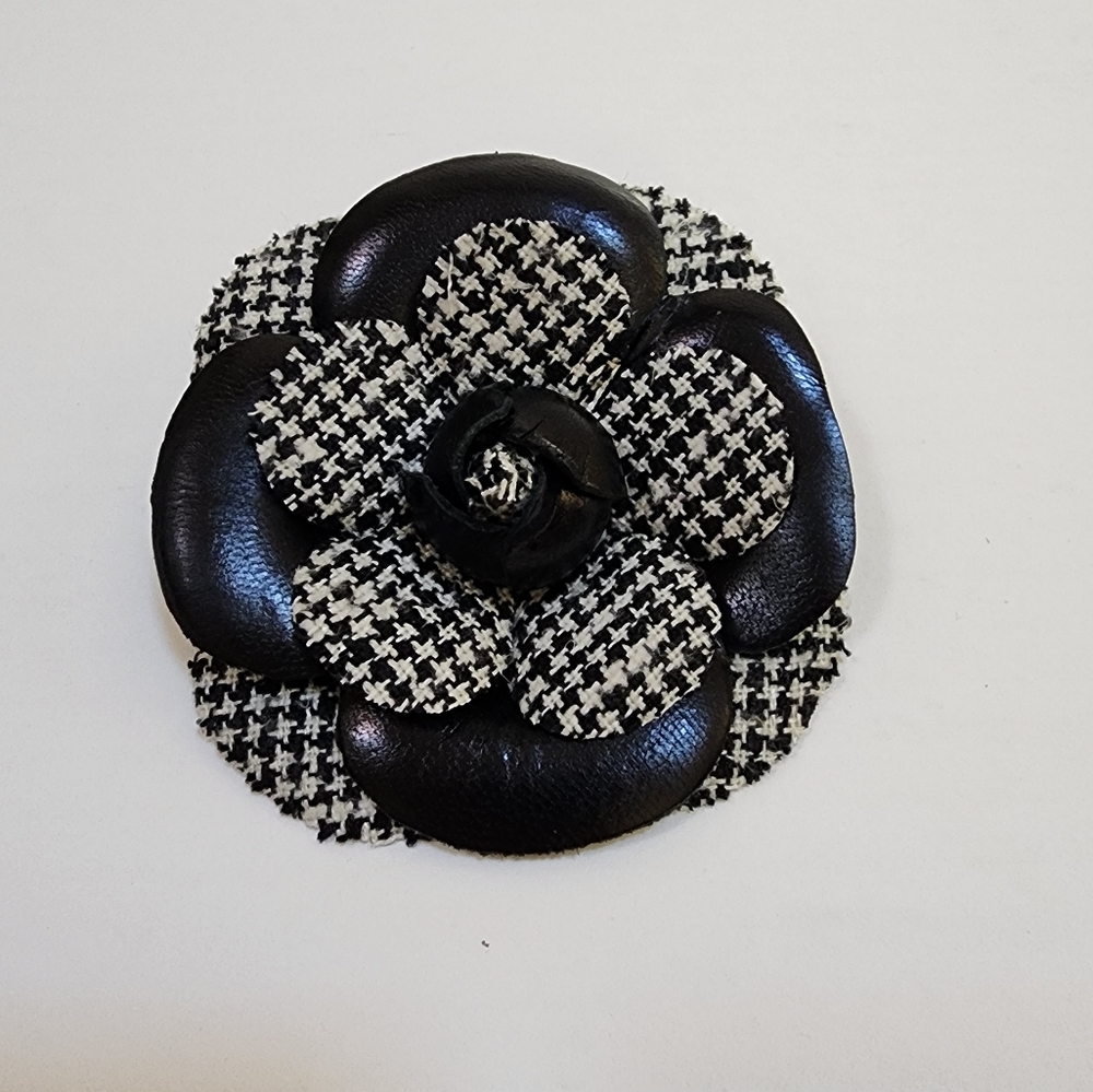 BLACK AND WHITE FLOWER PIN MADE OF TINY CHECKED FABRIC AND FAUX LEATHER. UNIQUE.
